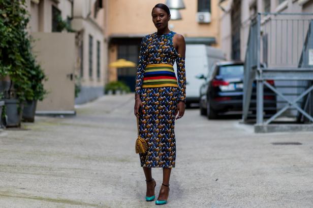 MILAN, ITALY - SEPTEMBER 23: Stylist Ogo Offodile wearing a dress with long sleeves and heels outside Armani during Milan Fashion Week Spring/Summer 2017 on September 23, 2016 in Milan, Italy. (Photo by Christian Vierig/Getty Images)