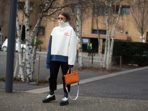 LONDON, ENGLAND - FEBRUARY 19:  A guest wears a "Great, However" top and V73 bag on day 3 of the London Fashion Week February 2017 collections on February 19, 2017 in London, England.  (Photo by Melodie Jeng/Getty Images)