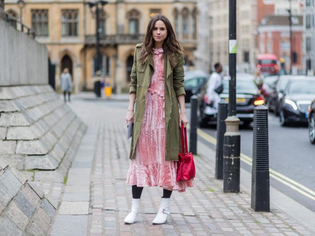 LONDON, ENGLAND - FEBRUARY 19: A guest wearing a green coat, pink dress outside Preen by Thornton Bregazzi on day 3 of the London Fashion Week February 2017 collections on February 19, 2017 in London, England. (Photo by Christian Vierig/Getty Images) *** Local Caption ***
