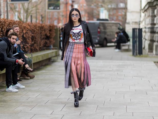 LONDON, ENGLAND - FEBRUARY 20: A guest wearing a black leather jacket, white tshirt, skirt outside Christopher Kane on day 4 of the London Fashion Week February 2017 collections on February 20, 2017 in London, England. (Photo by Christian Vierig/Getty Images)
