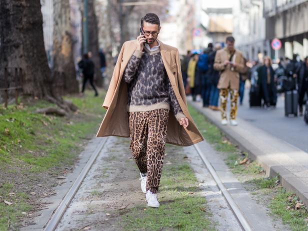 MILAN, ITALY - FEBRUARY 26: Simone Marchetti wearing leoprint pants, beige wool coat outside Dolce & Gabbana  during Milan Fashion Week Fall/Winter 2017/18 on February 26, 2017 in Milan, Italy. (Photo by Christian Vierig/Getty Images)