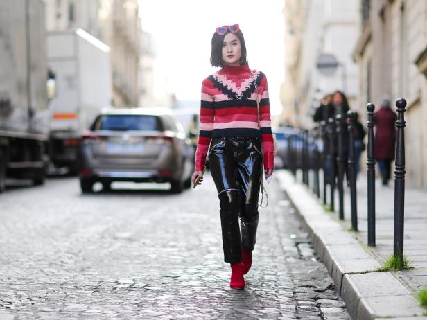 PARIS, FRANCE - MARCH 02:  Fashion blogger Miu wears a red top with stripes,  black vinyl pants, and red shoes, outside the Balmain show, during Paris Fashion Week Womenswear Fall/Winter 2017/2018, on March 2, 2017 in Paris, France.  (Photo by Edward Berthelot/Getty Images)