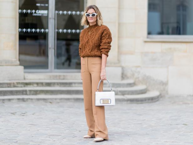 PARIS, FRANCE - MARCH 03: Anne-Laure Mais wearing a brown knut, brown pants, Dior bag outside Dior on March 3, 2017 in Paris, France. (Photo by Christian Vierig/Getty Images)