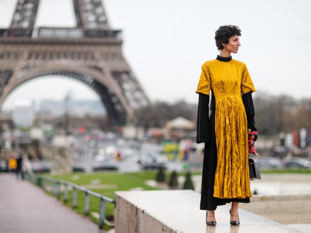 PARIS, FRANCE - MARCH 06:  A guest wears a black and yellow dress with fringes, outside the Hermes show, during Paris Fashion Week Womenswear Fall/Winter 2017/2018, on March 6, 2017 in Paris, France.  (Photo by Edward Berthelot/Getty Images)