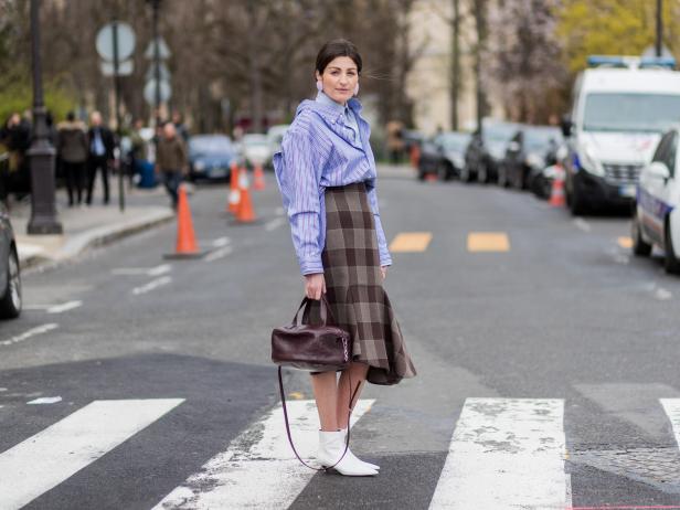 PARIS, FRANCE - MARCH 07: A guest wearing a striped button shirt, checked skirt outside Chanel on March 7, 2017 in Paris, France. (Photo by Christian Vierig/Getty Images)
