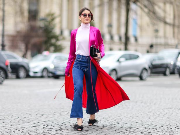 PARIS, FRANCE - MARCH 07:  Camila Coelho wears a pink turtleneck pull over, a pink and red jacket, blue jeans, and black shoes, outside the Chanel show, during Paris Fashion Week Womenswear Fall/Winter 2017/2018, on March 7, 2017 in Paris, France.  (Photo by Edward Berthelot/Getty Images)