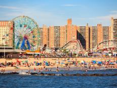 New York, NY, USA - August 30, 2016: Beach in Coney Island: People enjoy beach: Coney Island is a peninsular residential neighborhood, beach, and leisure/entertainment.