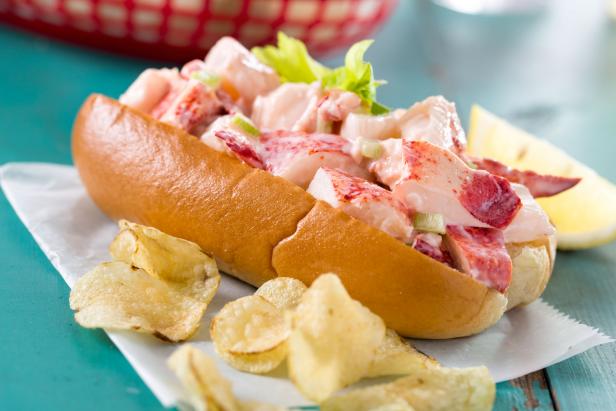 A fresh made Maine / New England lobster roll with mayonnaise, celery, butter, and lemon with a side of chips.  Please see my portfolio for other food and drink images.