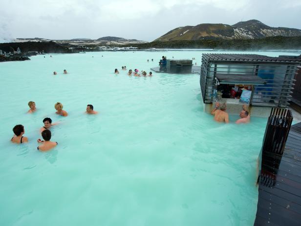 Reykjavik, Iceland - March 08, 2013: People bathing in The Blue Lagoon, a geothermal bath resort in the south of Iceland, a 'must see' by tourists. The water is sourced from a power station nearby.