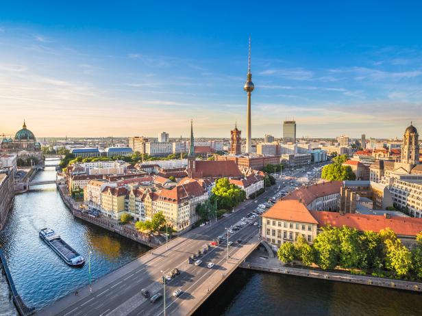 Aerial view of Berlin skyline with famous TV tower and Spree river in beautiful evening light at sunset, Germany