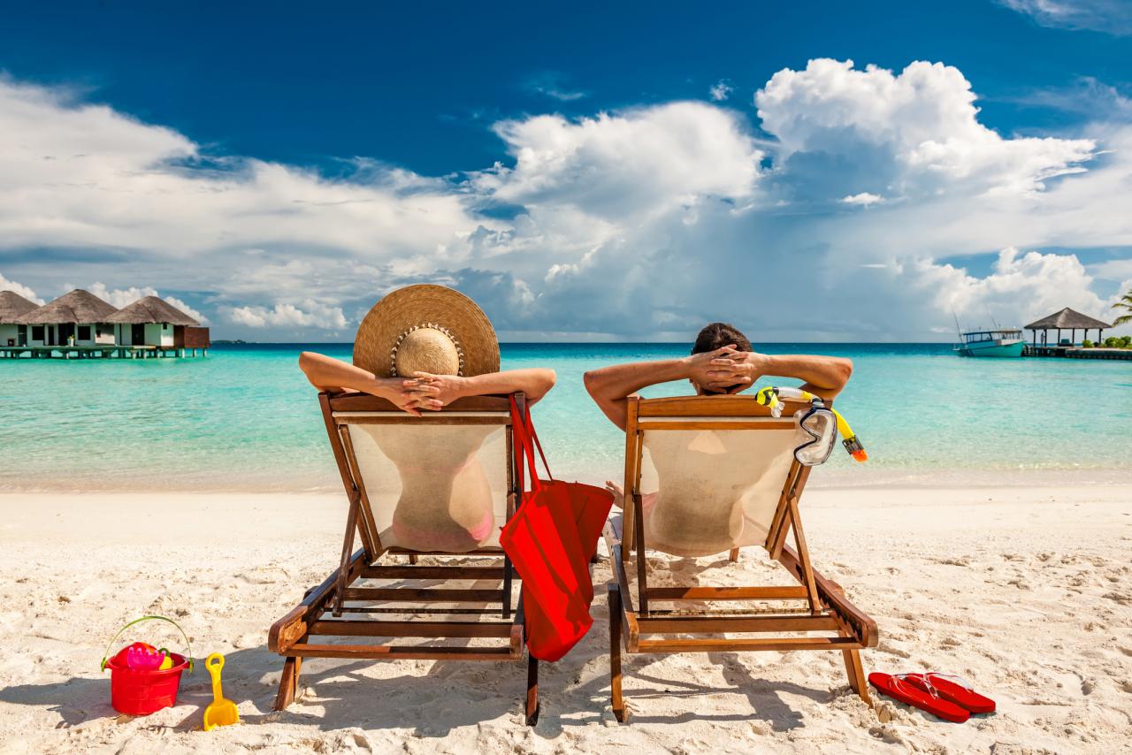 couple lounging near beachfront