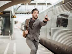 Photo of a businessman trying to catch the train