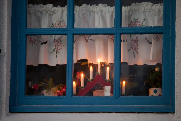 REYKJAVIK, ICELAND - DECEMBER 07: Traditional candles light a home's window for Christmas, on December 7, 2017 in Reykjavik, Iceland. Candles are a big part of holiday decor here. (Photo by Melanie Stetson Freeman/The Christian Science Monitor via Getty Images)