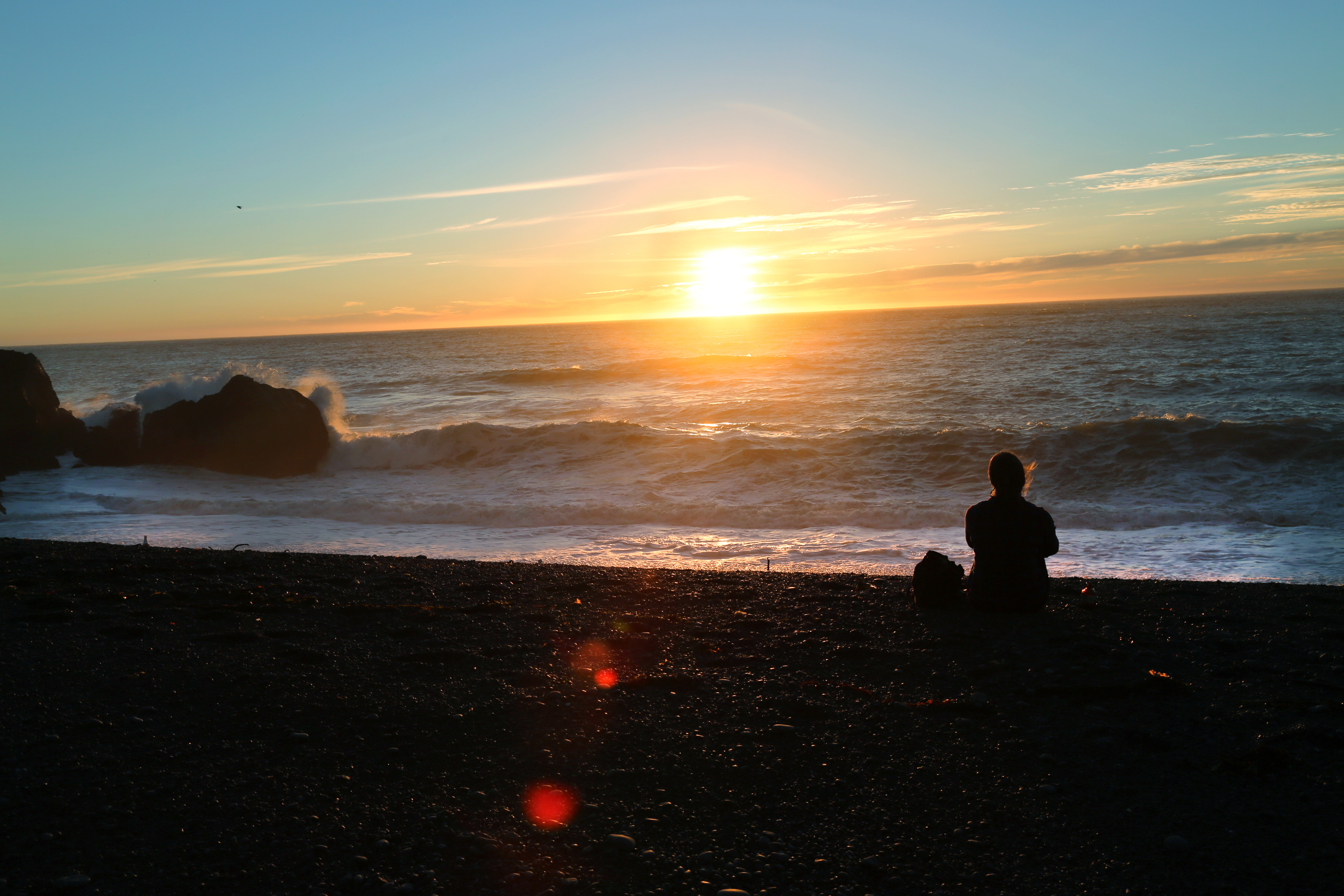 Christina Cindrich admiring sunset on Secret Cove in Humbolt County, California  as seen on Travel Channel's Top Secret Beaches episode TTSB102H.