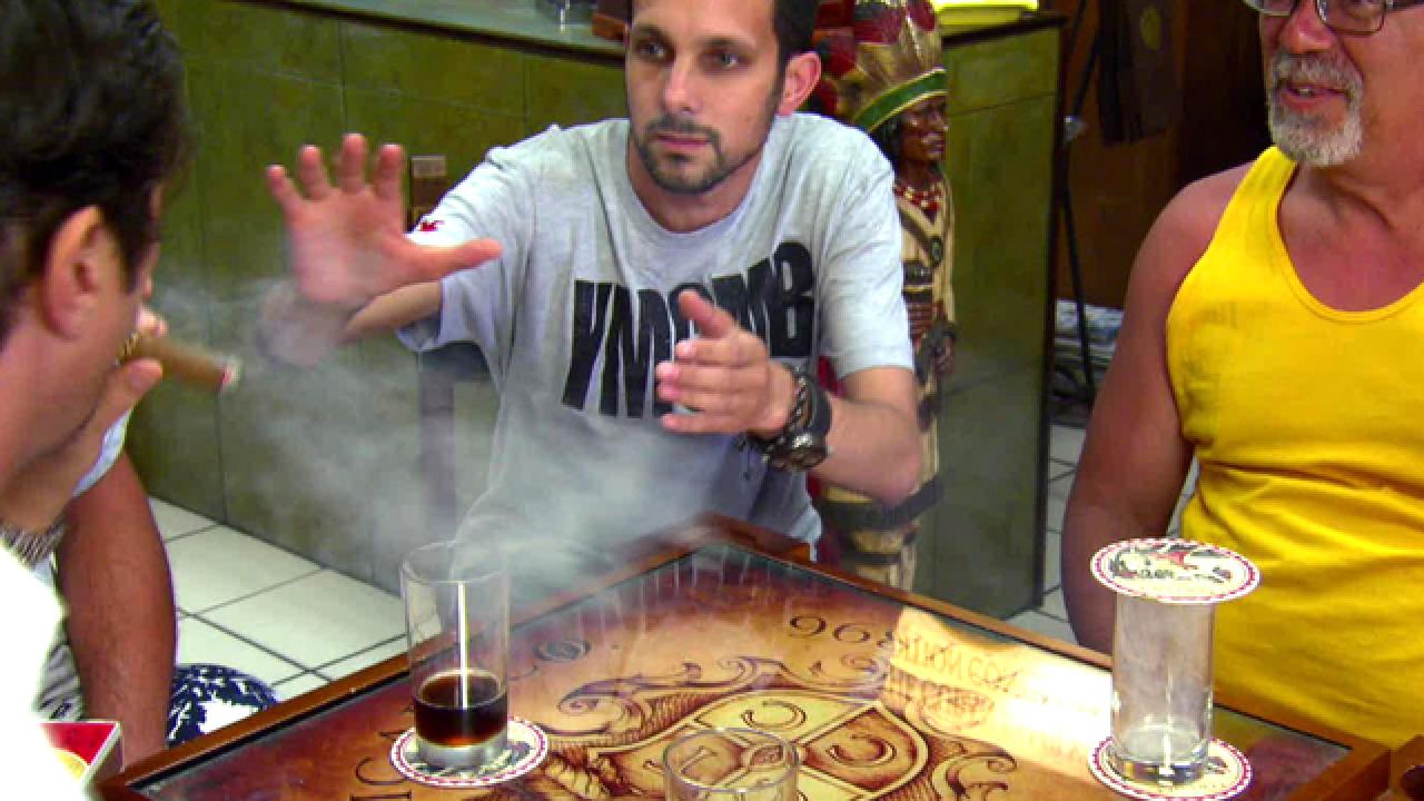 Magician Baffles Cigar Smokers